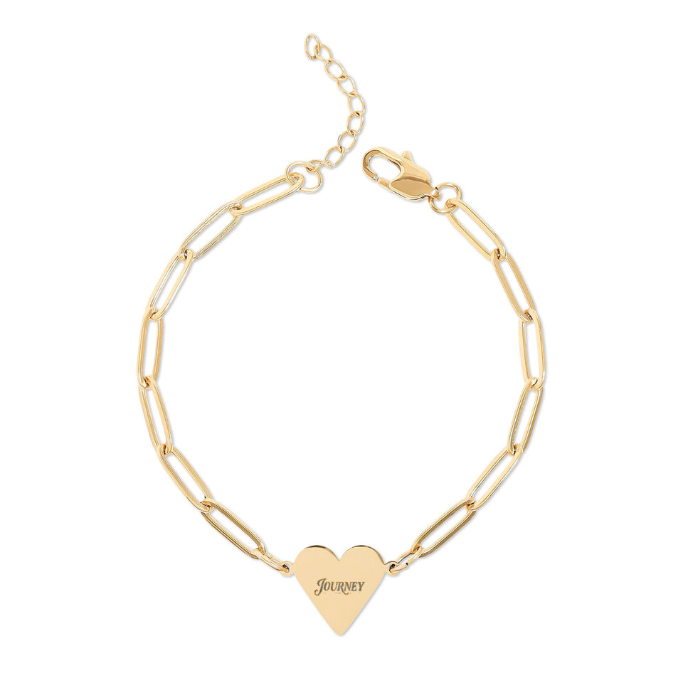 Personalized heart bracelet featuring engraved heart charm on modern paperclip gold chain.